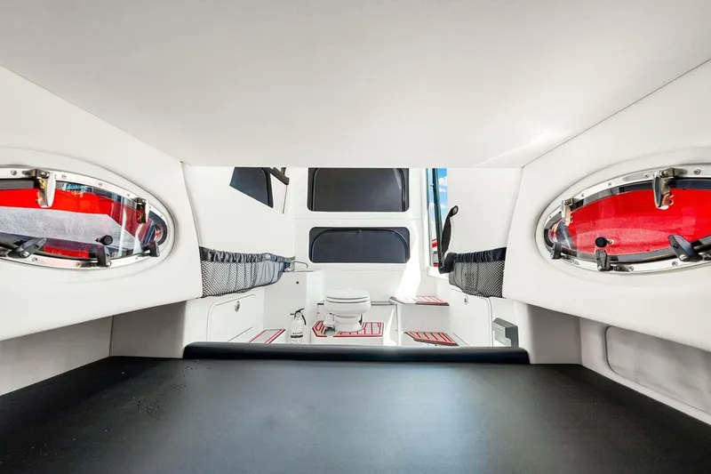 Slide: The Image of 2022 Nor-Tech 390 SS cabin interior with modern design and red accents. - 46