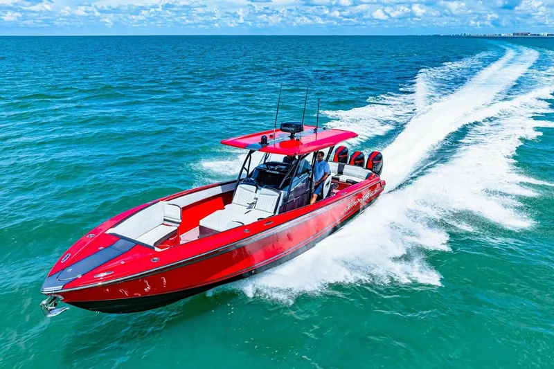 Slide: The Image of 2022 Nor-Tech 390 SS speedboat cruising on open water, vibrant red design. - 78