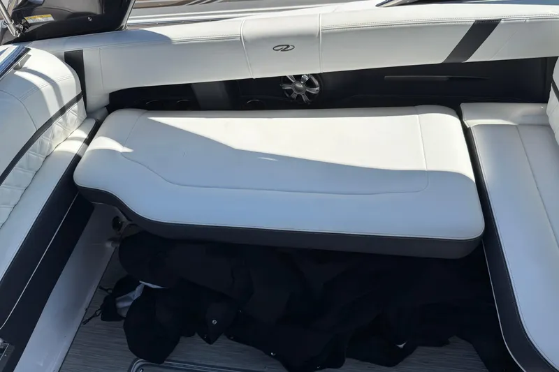 Slide: The Image of 2018 Regal 2800 Bowrider interior with white cushioned seating and sleek design. - 3