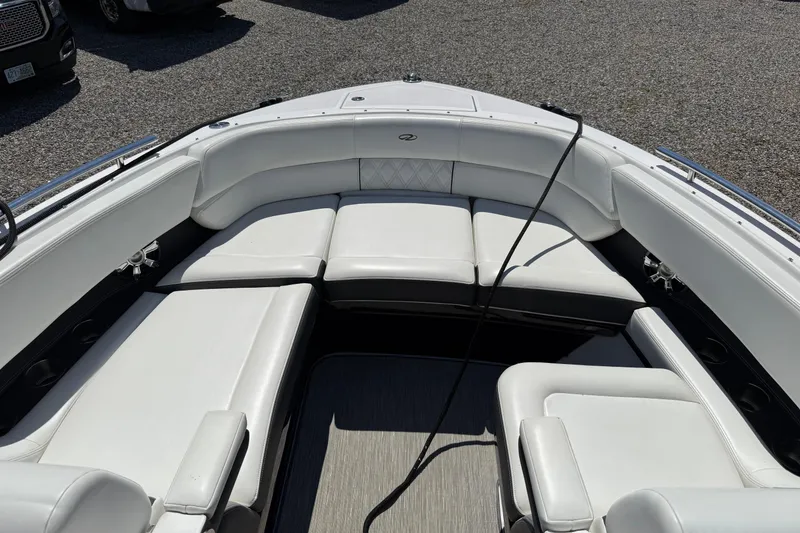 Slide: The Image of 2018 Regal 2800 Bowrider boat with spacious white seating area. - 6