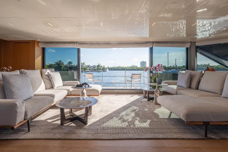 Slide: The Image of Luxurious 2023 Sanlorenzo SL120A yacht interior with elegant seating and panoramic ocean view. - 16