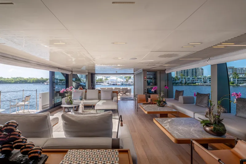 Slide: The Image of Luxurious interior of 2023 Sanlorenzo SL120A yacht with elegant seating and waterfront view. - 18
