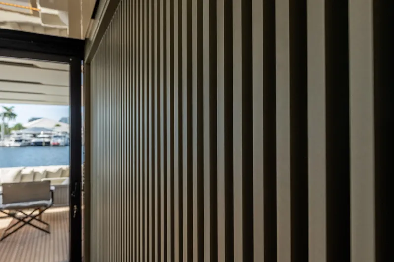 Slide: The Image of Interior view of 2023 Sanlorenzo SL120A yacht with modern striped wall design. - 25