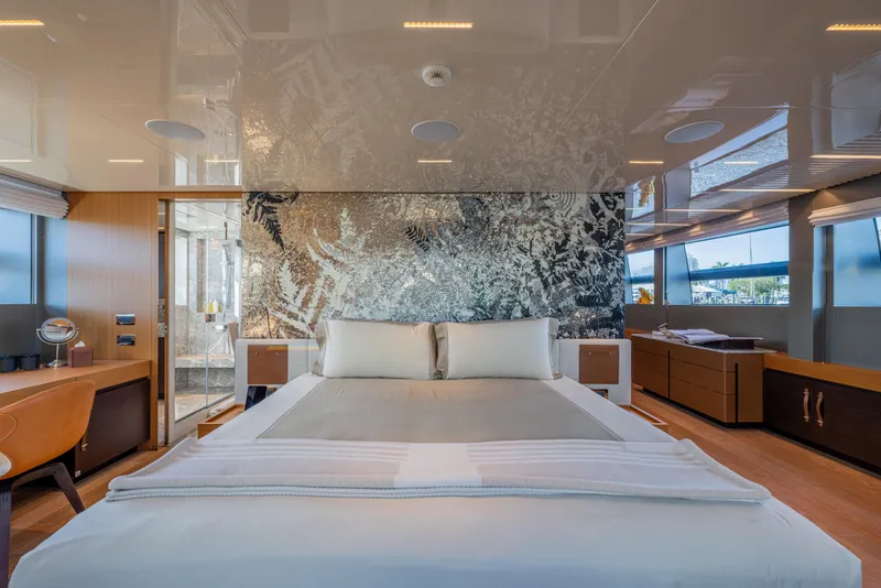 Slide: The Image of Luxurious bedroom interior of 2023 Sanlorenzo SL120A yacht with modern decor and large windows. - 26