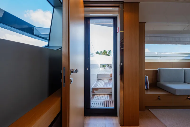 Slide: The Image of Interior view of 2023 Sanlorenzo SL120A yacht, featuring modern design and outdoor deck access. - 28