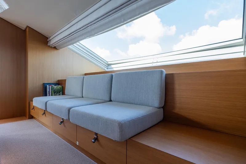 Slide: The Image of Modern interior of 2023 Sanlorenzo SL120A yacht with sleek seating and large window. - 30