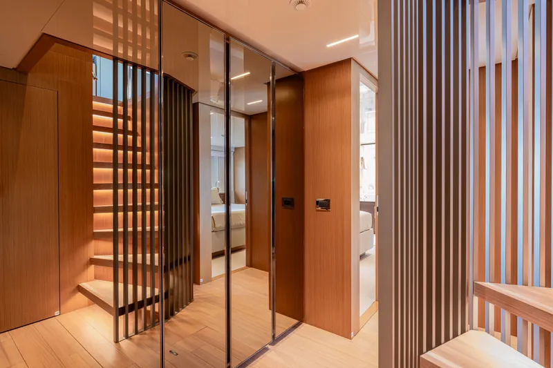 Slide: The Image of Luxurious interior of 2023 Sanlorenzo SL120A yacht with modern wood finishes and elegant design. - 35