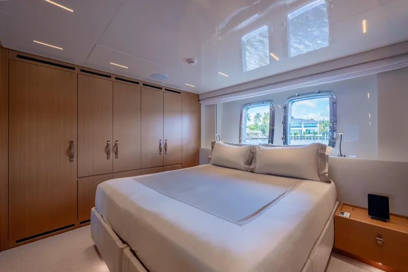 Slide: The Image of Luxurious bedroom interior of 2023 Sanlorenzo SL120A yacht with elegant wood finishes. - 43