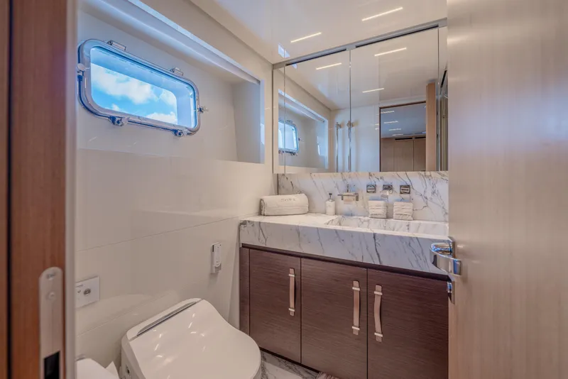 Slide: The Image of Luxurious bathroom on 2023 Sanlorenzo SL120A yacht with marble sink and modern fixtures. - 44