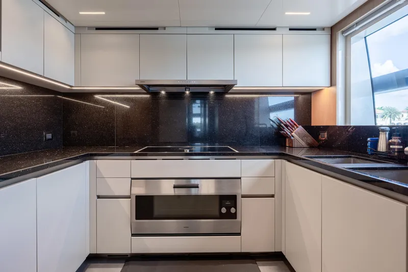Slide: The Image of Modern kitchen in 2023 Sanlorenzo SL120A yacht with sleek cabinetry and stainless steel appliances. - 49