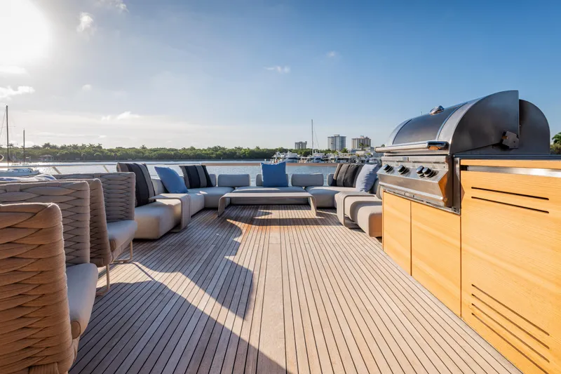 Slide: The Image of Luxurious 2023 Sanlorenzo SL120A yacht deck with modern seating and barbecue grill. - 52