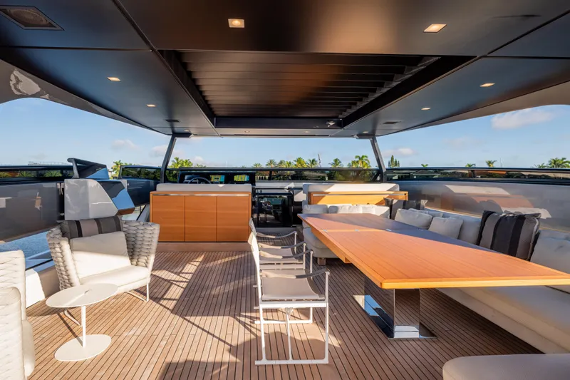 Slide: The Image of Luxurious 2023 Sanlorenzo SL120A yacht deck with elegant seating and dining area. - 57