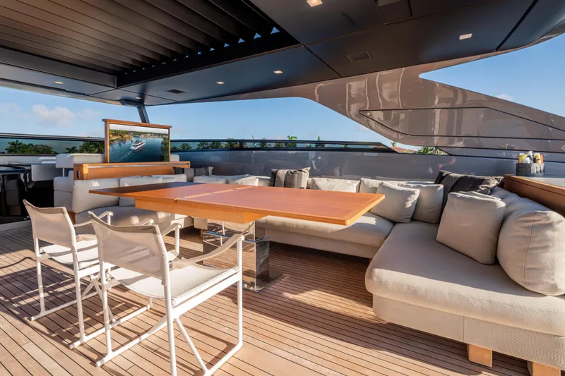 Slide: The Image of Luxurious 2023 Sanlorenzo SL120A yacht deck with elegant seating and dining area. - 58