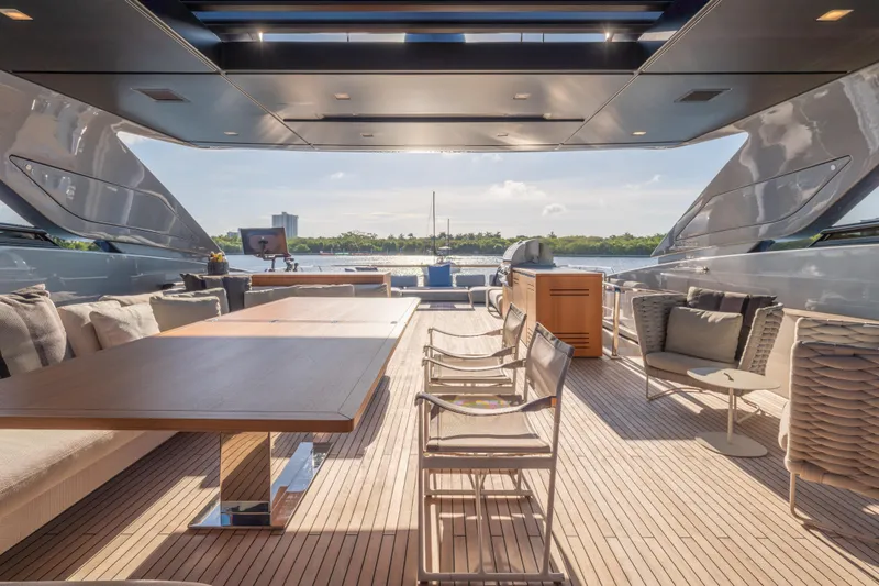 Slide: The Image of Luxurious 2023 Sanlorenzo SL120A yacht deck with elegant seating and scenic water view. - 61