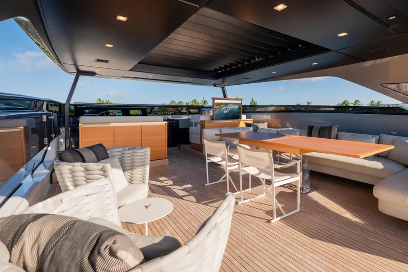 Slide: The Image of Luxurious 2023 Sanlorenzo SL120A yacht deck with elegant seating and dining area. - 62