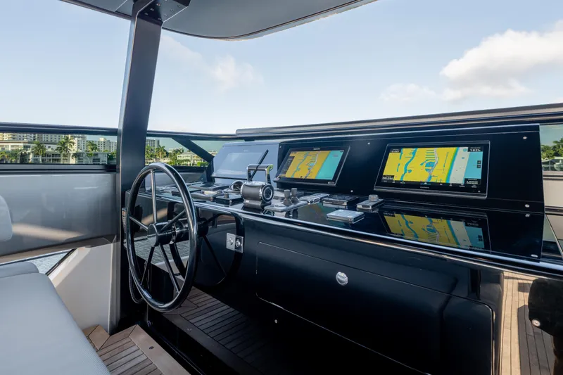 Slide: The Image of 2023 Sanlorenzo SL120A yacht helm with modern navigation displays and sleek design. - 65