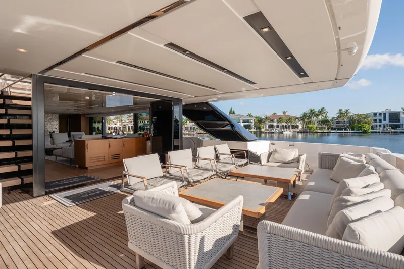 Slide: The Image of Luxurious 2023 Sanlorenzo SL120A yacht deck with elegant seating and waterfront view. - 68