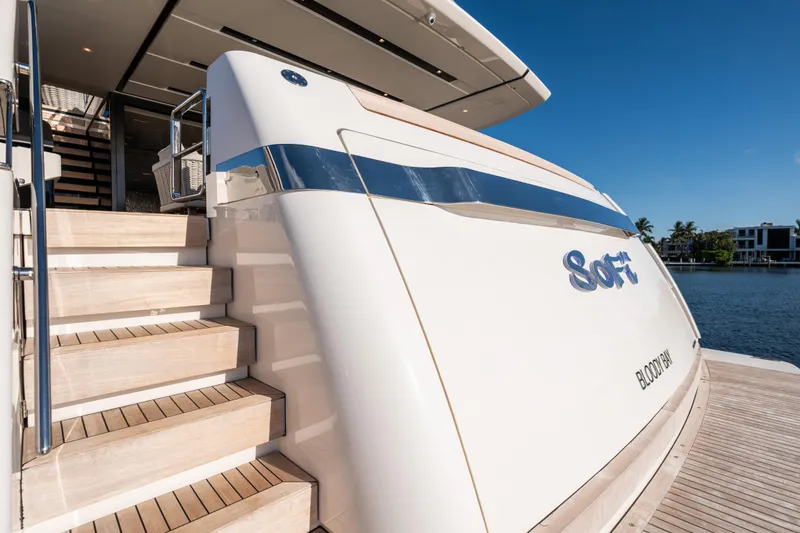 Slide: The Image of Luxury Sanlorenzo SL120A yacht, 2023 model, docked with elegant wooden steps and sleek design. - 69