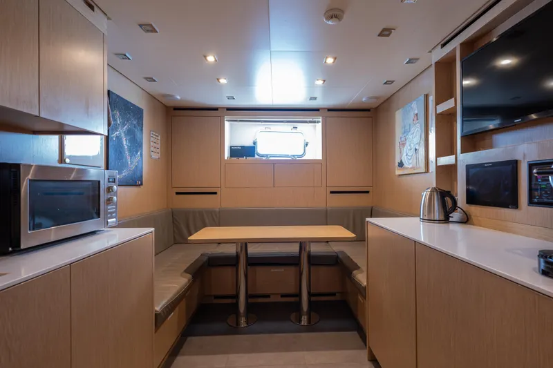 Slide: The Image of Luxurious interior of 2023 Sanlorenzo SL120A yacht with modern kitchen and dining area. - 70