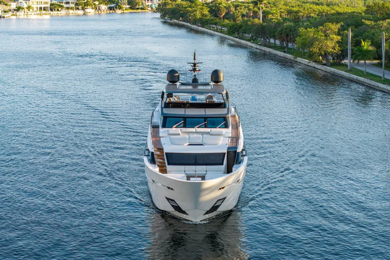 Slide: The Image of 2023 Sanlorenzo SL120A yacht cruising on a scenic waterway. - 9