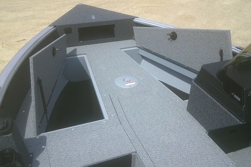 Slide: The Image of 2026 Lund 1800 Explorer SS boat interior with open storage compartments. - 4