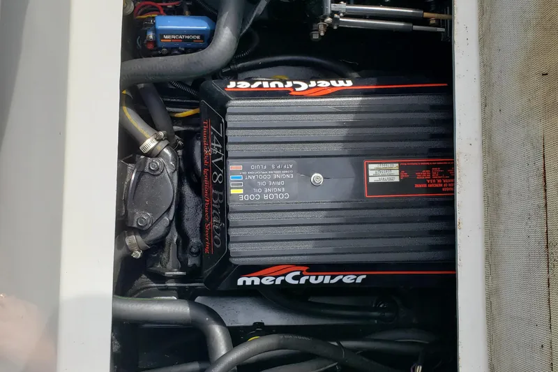 Slide: The Image of Engine compartment of a 1993 Searay 250EC with MerCruiser components visible. - 16