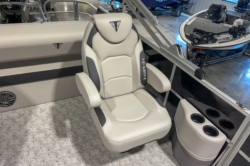 Slide: The Image of Luxurious seating in 2025 Trifecta 22UL LE boat, featuring sleek design and cup holders. - 10