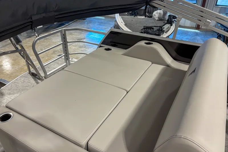Slide: The Image of Luxurious seating area on 2025 Trifecta 22UL LE pontoon boat with cup holders. - 11