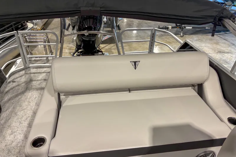 Slide: The Image of 2025 Trifecta 22UL LE boat interior with gray seating and cup holders. - 4