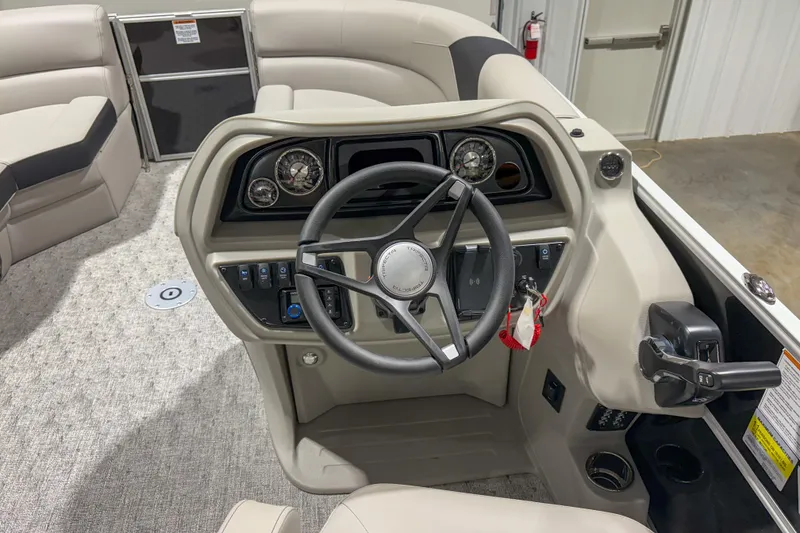 Slide: The Image of 2025 Trifecta 22UL LE boat interior with steering wheel and control panel. - 7