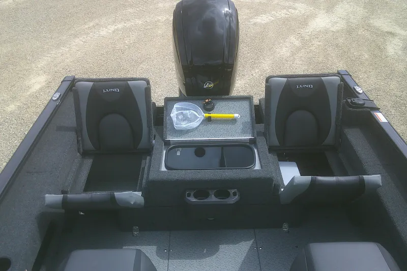 Slide: The Image of 2026 Lund 1675 Adventure SS boat interior with seating and storage compartments. - 12