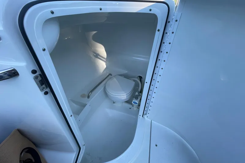 Slide: The Image of 2005 Formula 240 Bowrider boat interior with compact marine toilet. - 11
