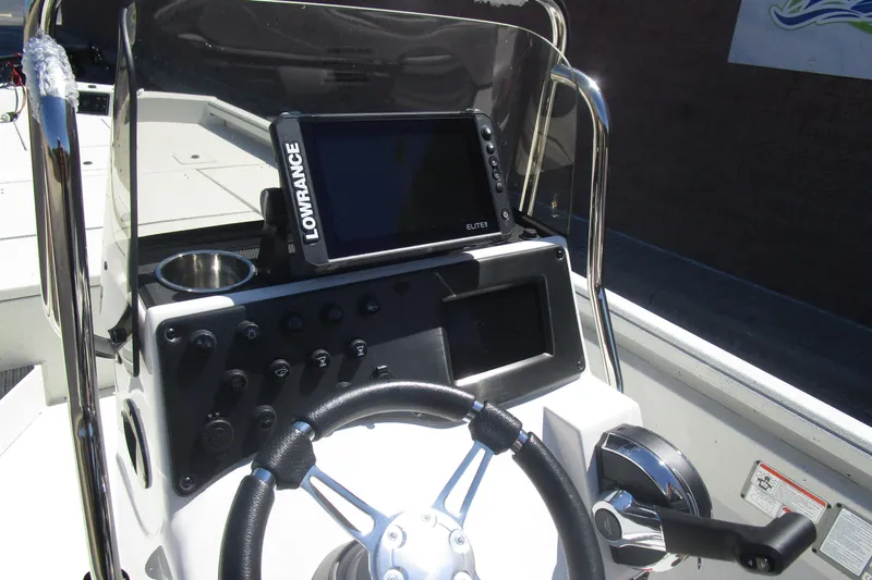 Slide: The Image of 2025 Ranger RB210 boat console with steering wheel and Lowrance Elite display. - 11