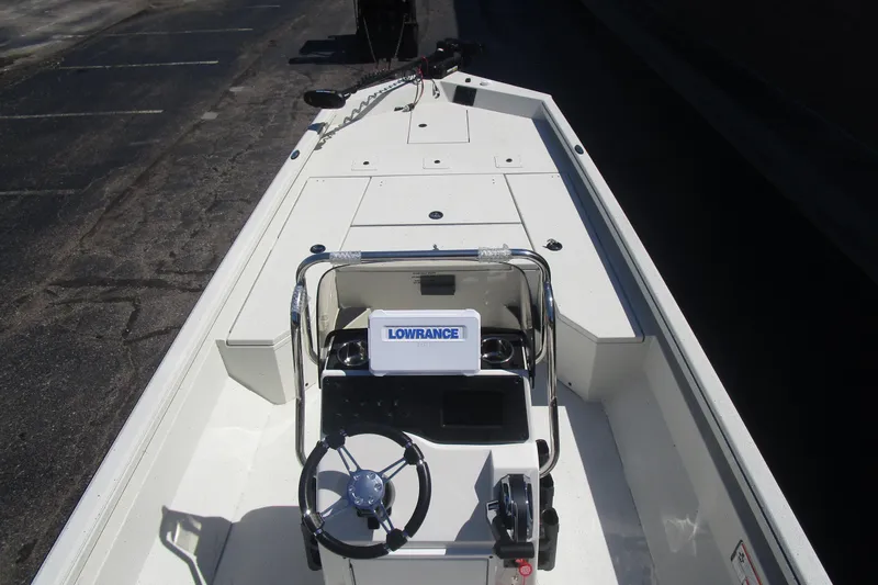 Slide: The Image of 2025 Ranger RB210 boat interior with steering console and Lowrance equipment. - 12