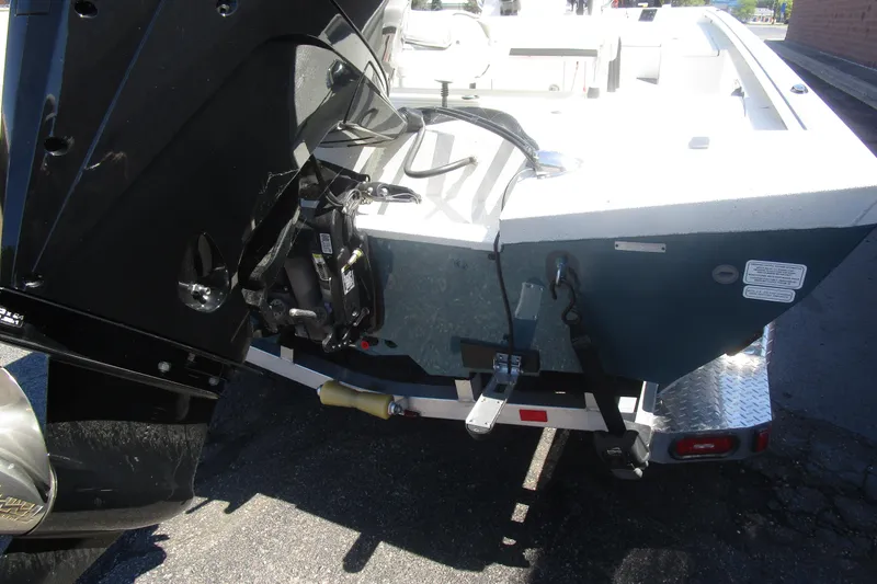 Slide: The Image of 2025 Ranger RB210 boat with outboard motor and trailer, rear view. - 17
