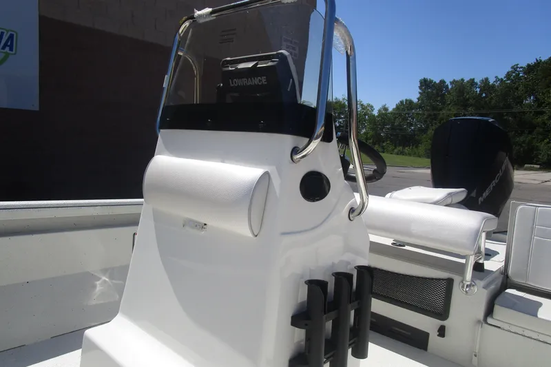 Slide: The Image of 2025 Ranger RB210 boat console with Lowrance electronics and Mercury engine in a sunny setting. - 9