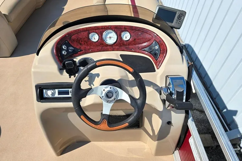 Slide: The Image of Steering console of a 2012 Sun Tracker 22 Party Barge Deluxe pontoon boat. - 12
