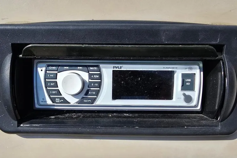 Slide: The Image of Pyle stereo system in 2012 Sun Tracker 22 Party Barge Deluxe, featuring USB and SD inputs. - 14