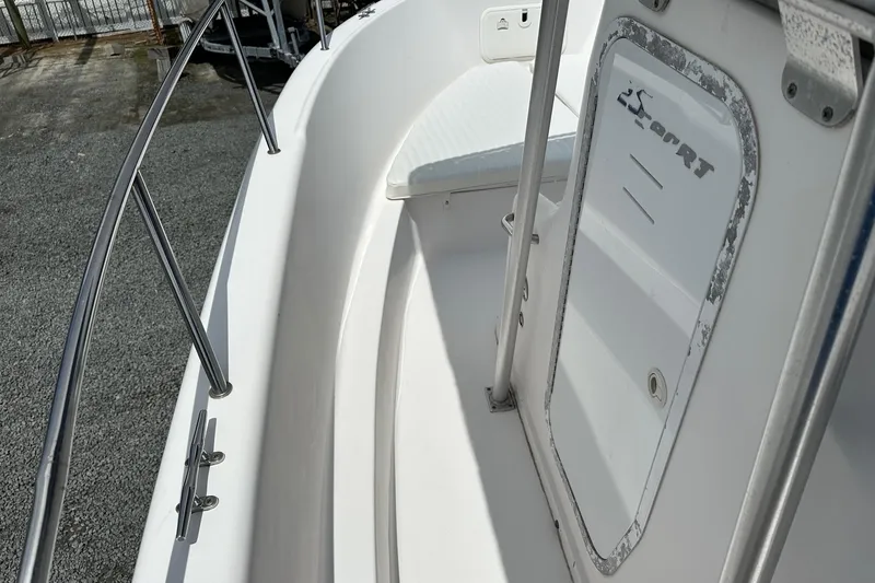 Slide: The Image of 2003 PROLINE Sport Center Console boat interior with stainless steel railings. - 12