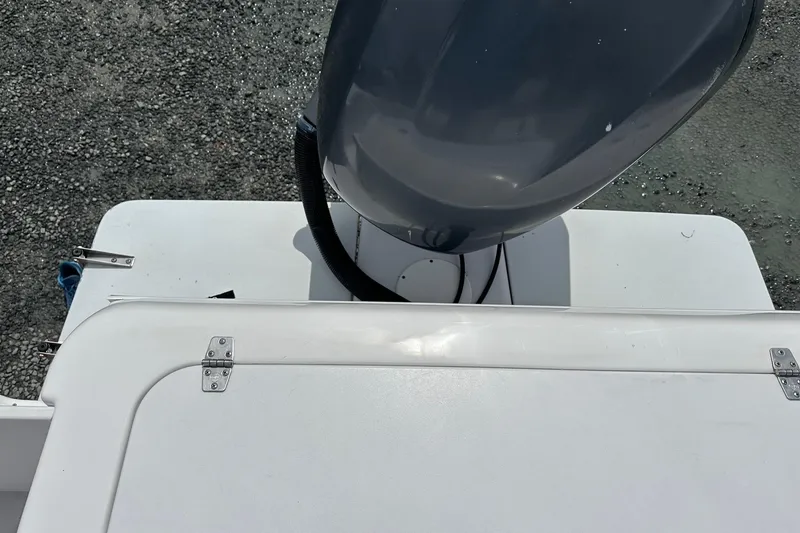 Slide: The Image of 2003 PROLINE Sport Center Console boat engine and deck view. - 17