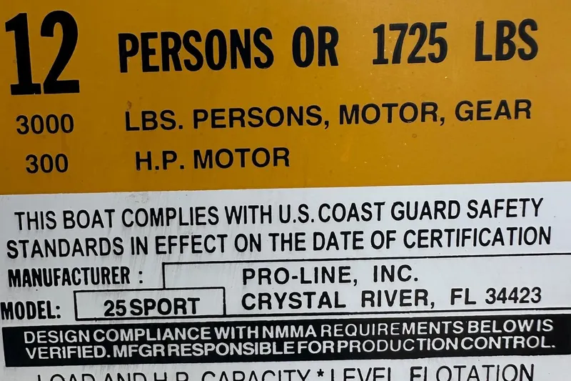 Slide: The Image of 2003 PROLINE Sport Center Console capacity label, 12 persons or 1725 lbs, U.S. Coast Guard compliant. - 7