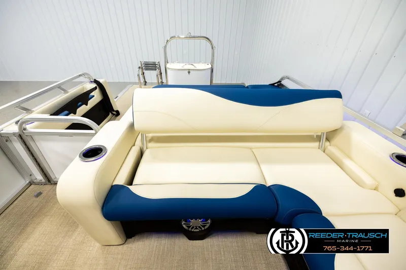 Slide: The Image of 2026 Avalon LSZ VRB boat interior with blue and cream seating, cup holders, and modern design. - 15