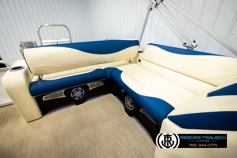 Slide: The Image of Luxurious seating on 2026 Avalon LSZ VRB pontoon boat, featuring blue and cream upholstery. - 20