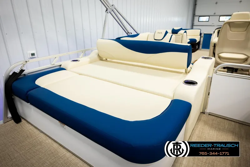 Slide: The Image of 2026 Avalon LSZ VRB boat interior with blue and cream seating, cup holders, and modern design. - 23