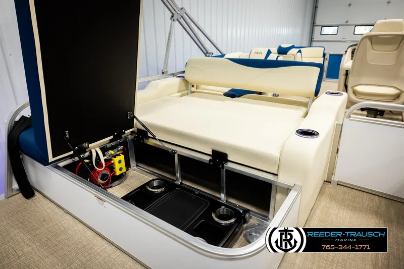 Slide: The Image of 2026 Avalon LSZ VRB boat interior with open storage compartment and seating. - 25