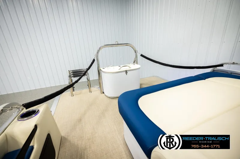 Slide: The Image of 2026 Avalon LSZ VRB boat interior with seating and storage, Reeder-Trausch Marine branding. - 31