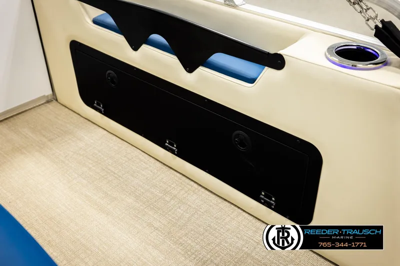 Slide: The Image of 2026 Avalon LSZ VRB boat interior with beige seating and blue accents. - 32