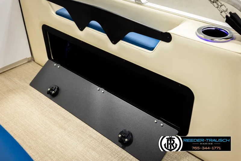 Slide: The Image of 2026 Avalon LSZ VRB boat interior with storage compartment and cup holder. - 33