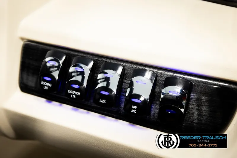Slide: The Image of Control panel of 2026 Avalon LSZ VRB with illuminated switches for docking, exterior lights, and radio. - 41
