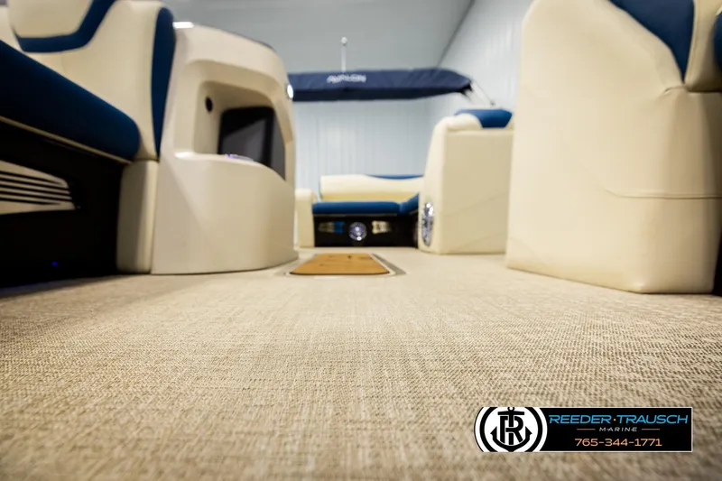Slide: The Image of Interior of 2026 Avalon LSZ VRB boat with beige flooring and blue seating. - 50
